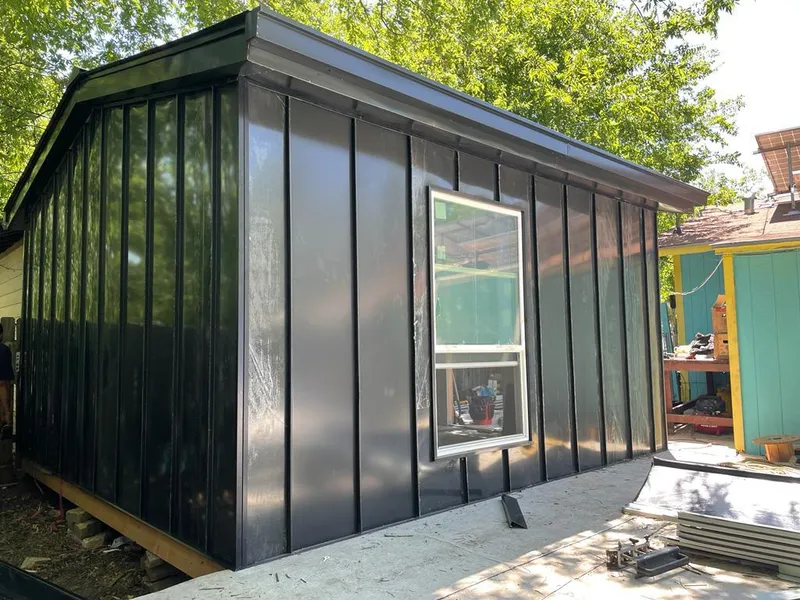 Black standing seam metal wall panels for Roof Inspection in Bloomingdale