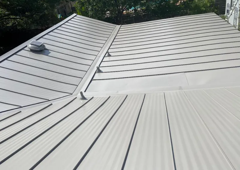 Solar attic fan installed on a metal roof for Roof Ventilation in Bloomingdale
